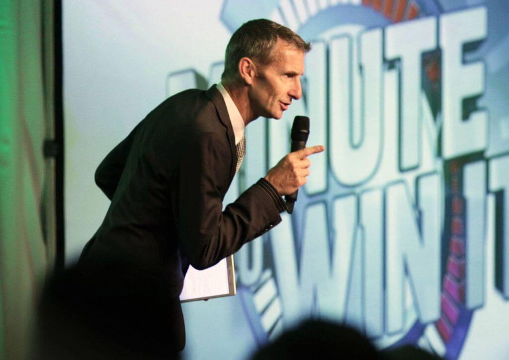 Quiz Time leader on a stage energising an event - Maximillion